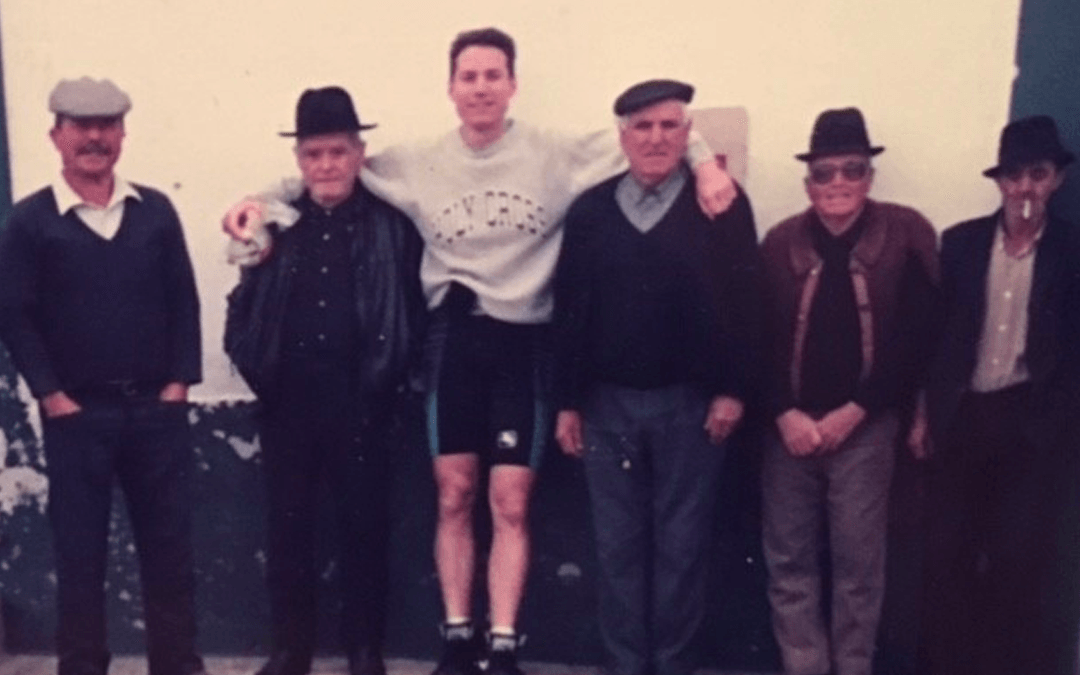 author pictured with villagers on his 1991 Portuguese bicycle journey
